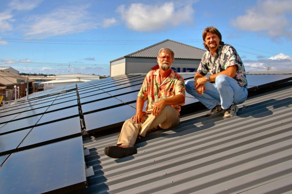 Marco & Doug on Hilo Ford dealership roof